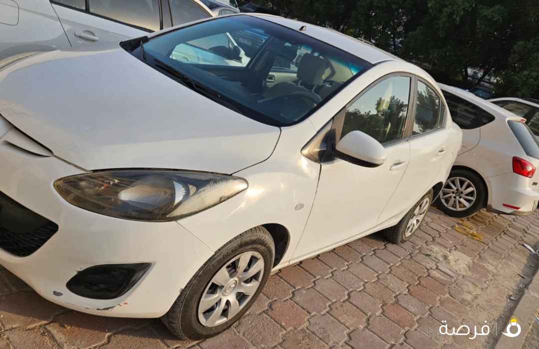 للبيع مازدا 2. 2012 شرط الفحص