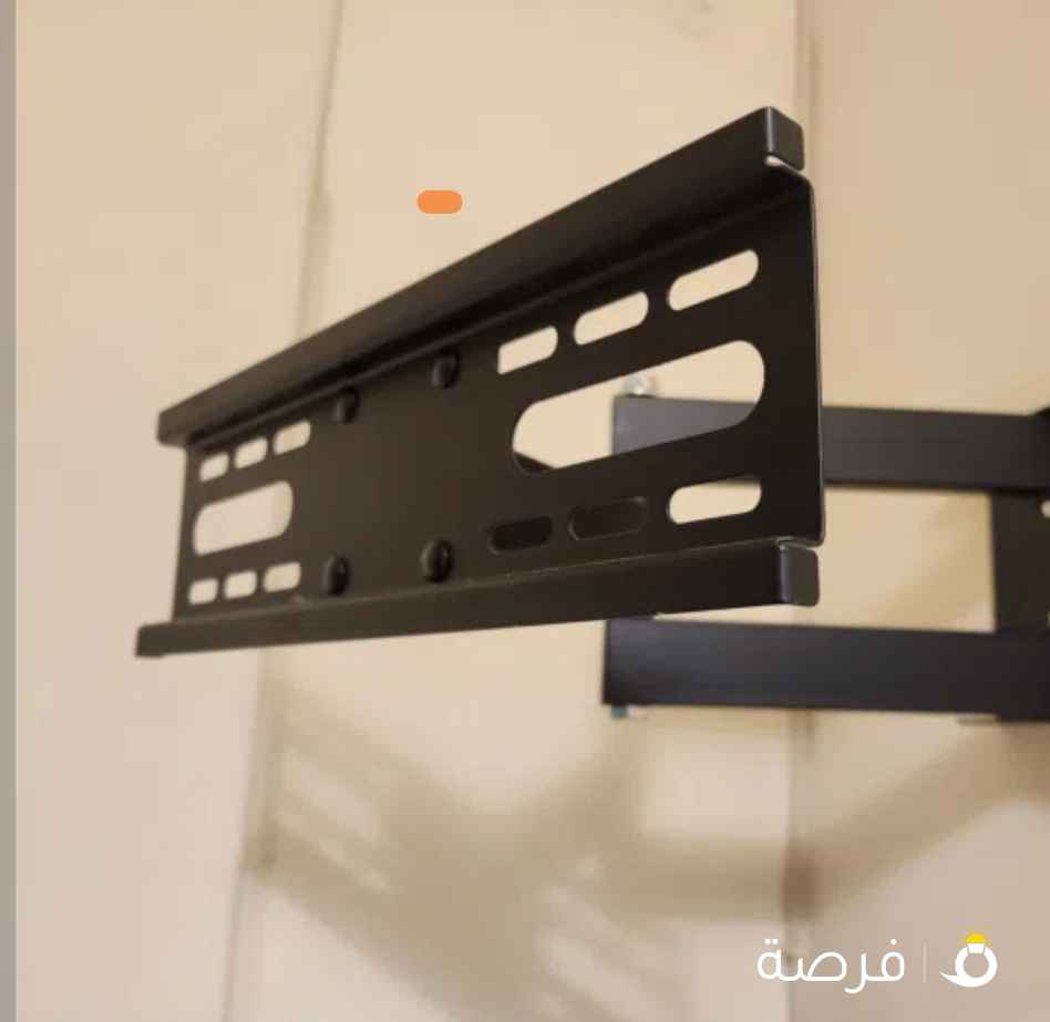 ستاند متحرك معلق بالحيط للتلفاز // تلفاز نوع شارب اكوا ⁦⁦32⁩⁩ بوصة // شمعدانتين فضيات على شكل ورق شجر