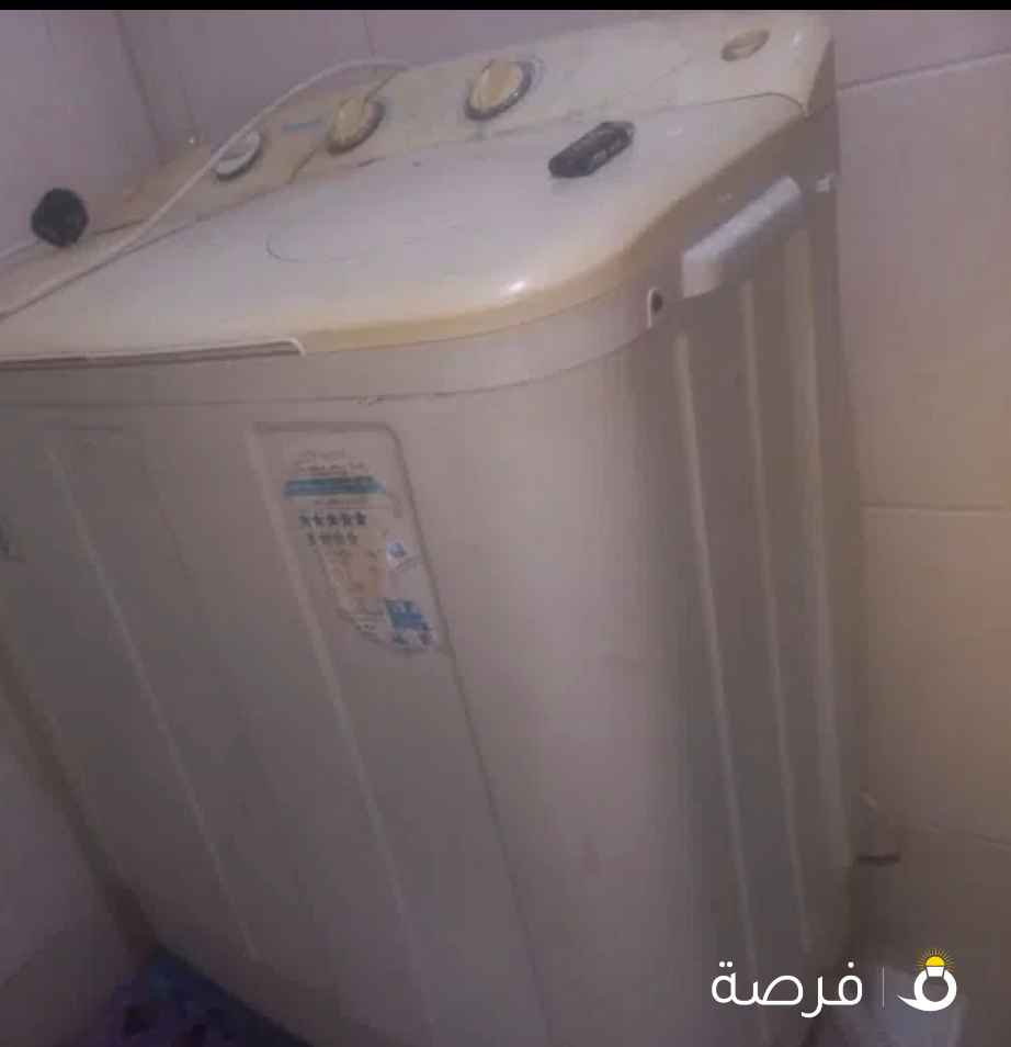 غساله ملابس تشتغل نشافه بس